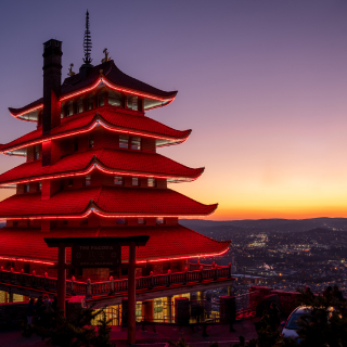 The red lights of the Reading Pagoda at night overlooking the city of Reading.