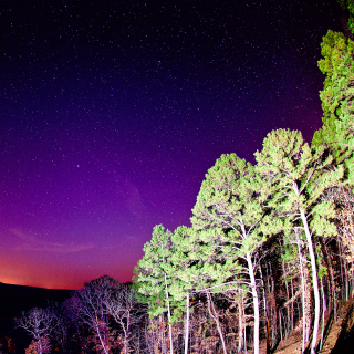 Photograph of a sunset and milky way in Batesville, Arkansas in the foothills of the Ozark Mountains