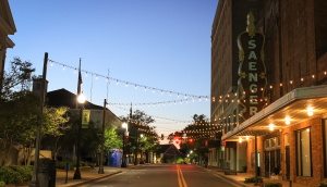 A historic theater with lights in the evening in Hattiesburg, MS.