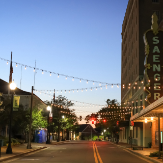 A historic theater with lights in the evening in Hattiesburg, MS.