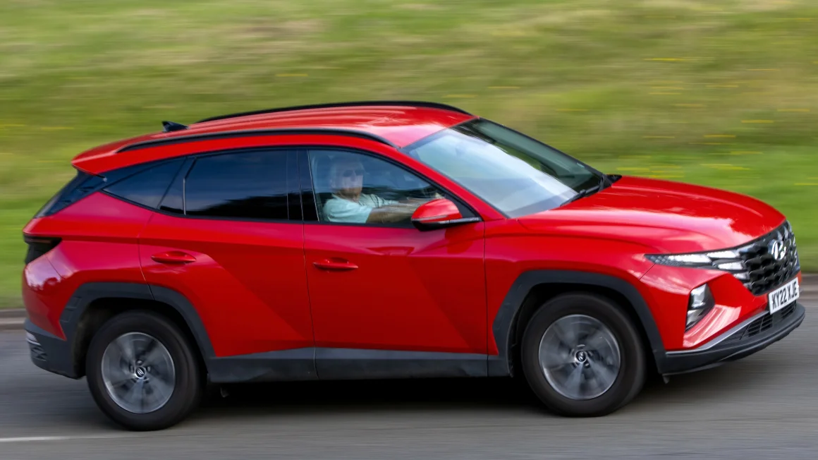 2022 red Hyundai Tucson hybrid electric car – cheap car insurance.