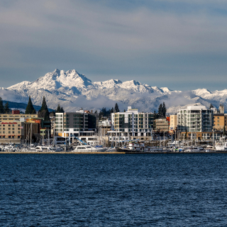 City skyline with snowy mountains of the Olympic peninsula on backdrop – cheap car insurance in Bremerton, WA