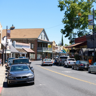 Busy day on Washington Street, Route 49, in historic Sonora downtown, cheap car insurance in California.