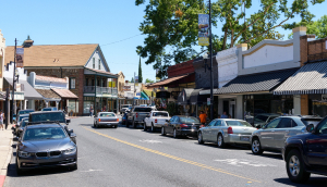 Busy day on Washington Street, Route 49, in historic Sonora downtown, cheap car insurance in California.