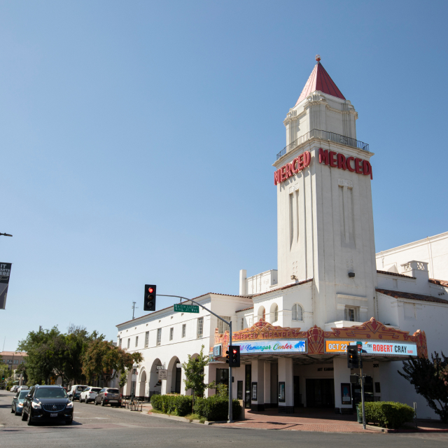 Sunlight shines on the historic Merced Theater.