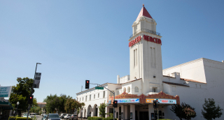 Sunlight shines on the historic Merced Theater.