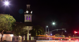 Night time traffic streams through historic downtown Red Bluff, California.
