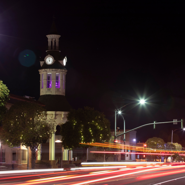 Night time traffic streams through historic downtown Red Bluff, California.