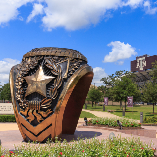 Texas A&M University college campus and stadium with class ring statue: Heart of Aggieland cheap car insurance in Texas.