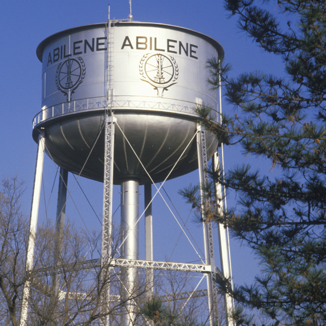 Abilene written on a water tower against clear sky, cheap car insurance in Texas.