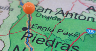 Eagle Pass, TX marked by an orange tack on a Texas road map: Eagle Pass affordable car insurance in Texas.