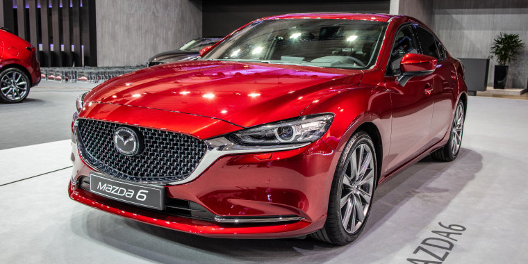 Metallic red Mazda 6 sedan at Poznan International Motor Show, Third generation, GL cheap car insurance.