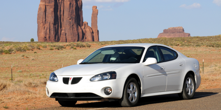 Pontiac Grand Prix, pictured in an iconic desert setting in Monument Valley, Arizona, on June 22, 2008 – cheap car insurance.
