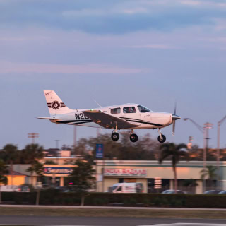 A plane lands at Page Field Airport on the Gulf Coast – Freeway, cheap car insurance in Fort Myers, Florida