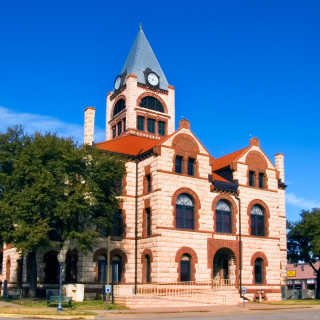 Erath County Courthouse with deep blue sky background: cheap car insurance in Texas.