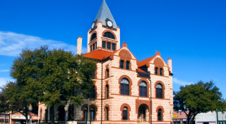 Erath County Courthouse with deep blue sky background: cheap car insurance in Texas.