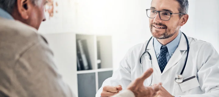 Consultation, man and doctor in office with conversation, help and advice for health insurance.