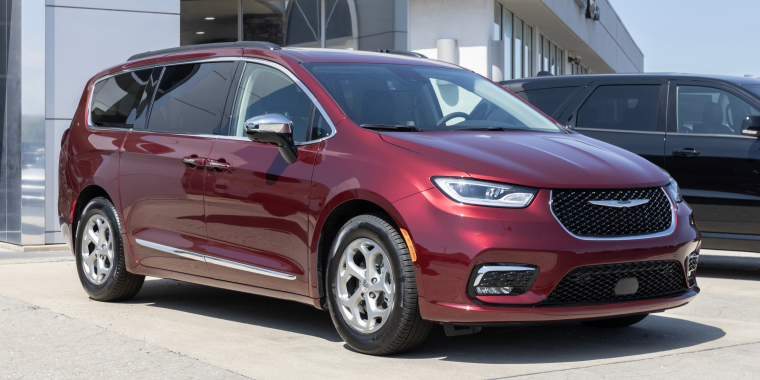 Chrysler Pacifica SUV minivan display at a dealership. Chrysler offers the Pacifica in Touring, Limited, Hybrid and Pinnacle models.