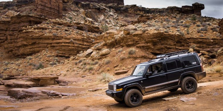 A black Jeep Commander traversed Moab's Canyonlands National Park along the Shaffer, White Rim, and Potash trails – cheap car insurance.