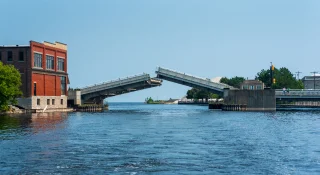 The Alpena draw bridge raised to allow boat traffic through on the Thunder Bay river – cheap car insurance in Michigan.