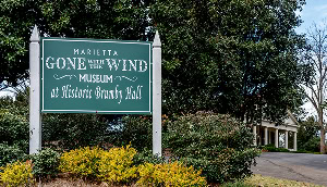 Sign outside Gone With the Wind Museum at Brumby Hall in Marietta – cheap car insurance in Georgia.
