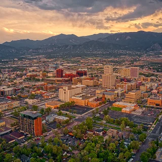Aerial View of Colorado Springs at Dusk – cheap car insurance in Colorado.