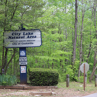 Sign at the entrance of the City Lake Natural Area in Cookeville – cheap car insurance in Tennessee.