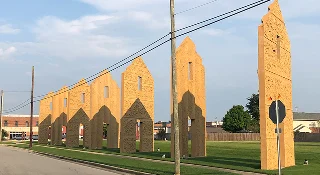Art installation by sculptor Thomas Sayre honoring Lenoir county’s rich history with tobacco dating back to 1759. The sculptures represent tobacco barn doors – cheap car insurance in North Carolina.