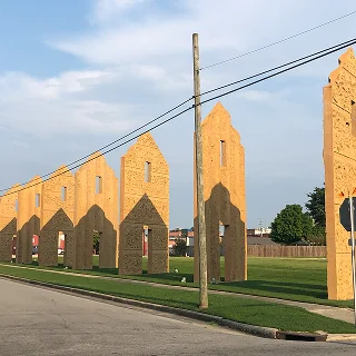Art installation by sculptor Thomas Sayre honoring Lenoir county’s rich history with tobacco dating back to 1759. The sculptures represent tobacco barn doors – cheap car insurance in North Carolina.