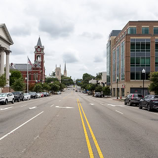 A view down a wide street in downtown Wilmington – cheap car insurance in North Carolina.
