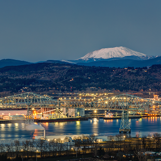 Twilight view of the Lewis & Clark bridge connecting Longview, WA with Rainier, OR – cheap car insurance in the PNC.