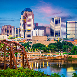 Shreveport skyline over the Red River at dusk– cheap car insurance in Louisiana.
