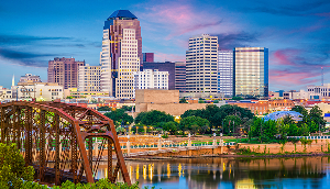 Shreveport skyline over the Red River at dusk– cheap car insurance in Louisiana.