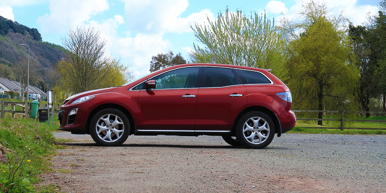 11th April 2021- A stylish Mazda CX-7 Sport Tech D, large five door family SUV, in a public parking area near Pendine, Carmarthenshire, Wales, UK – Mazda, cheap car insurance.