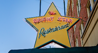 A sign hangs outside The Bright Star restaurant in Bessemer, Alabama. The Greek restaurant was founded in 1907 and is the oldest restaurant in Alabama – cheap car insurance in Alabama.