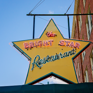 A sign hangs outside The Bright Star restaurant in Bessemer, Alabama. The Greek restaurant was founded in 1907 and is the oldest restaurant in Alabama – cheap car insurance in Alabama.