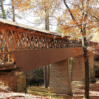 The Clarkson–Legg Covered Bridge, more simply known as Clarkson Covered Bridge, is a county-owned wooden covered bridge that spans Crooked Creek in Cullman County – cheap car insurance in Alabama.