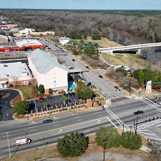 River Intersection Drone Shot Albany South Georgia Flint River showing cars driving safely. No car accidents.