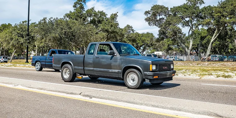Wide-angle front corner view of a 1993 GMC Sonoma Extended Cab at a local car show – Best cheap car insurance for a GMC.