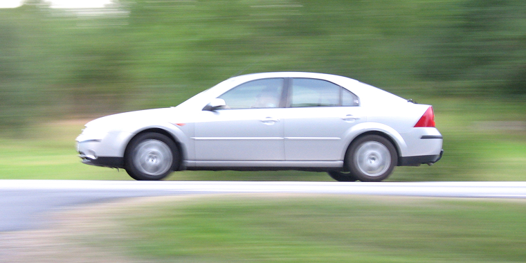 American car Mercury Milan moving at high speed with blurred background – cheap car insurance