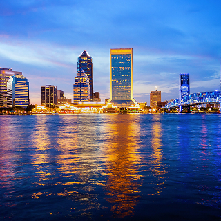 Jacksonville, Florida skyline over the St. John's River – cheap car insurance in Florida