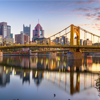 Pittsburgh, Pennsylvania, USA downtown city skyline on the Ohio River at dusk. – cheap car insurance in Pennsylvania