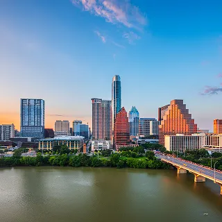 Austin, Texas, USA downtown city skyline on the Colorado River at dusk – cheap car insurance in Texas.