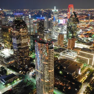 View of downtown Dallas, Texas. at night – cheap car insurance in Texas.