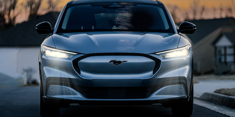 Ford Mustang Mach E all electric vehicle at sunset. Green energy with zero carbon emissions. Ford Mustang Mach E, cheap car insurance.