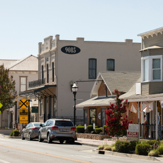 Afternoon sunlight shines on historic downtown Elk Grove, California.