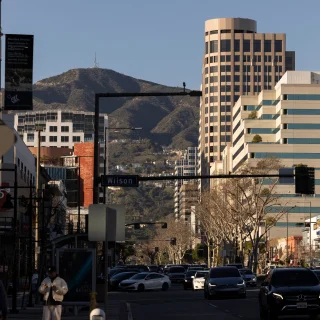 Afternoon traffic passes through the heart of downtown Glendale, California.