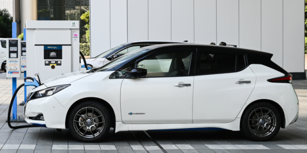 Electric cars, Nissan's LEAF, are being charged at the charging stations in front of the entrance of Nissan's Global Headquarters located in Yokohama, Japan. Cheap car insurance for Nissan.