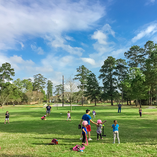 Diverse community members gathered outdoors in Humble, Texas – cheap car insurance in Texas.