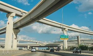 View of a major freeway system near Katy, Texas, with multiple highway lanes and overpasses – cheap car insurance in Texas.